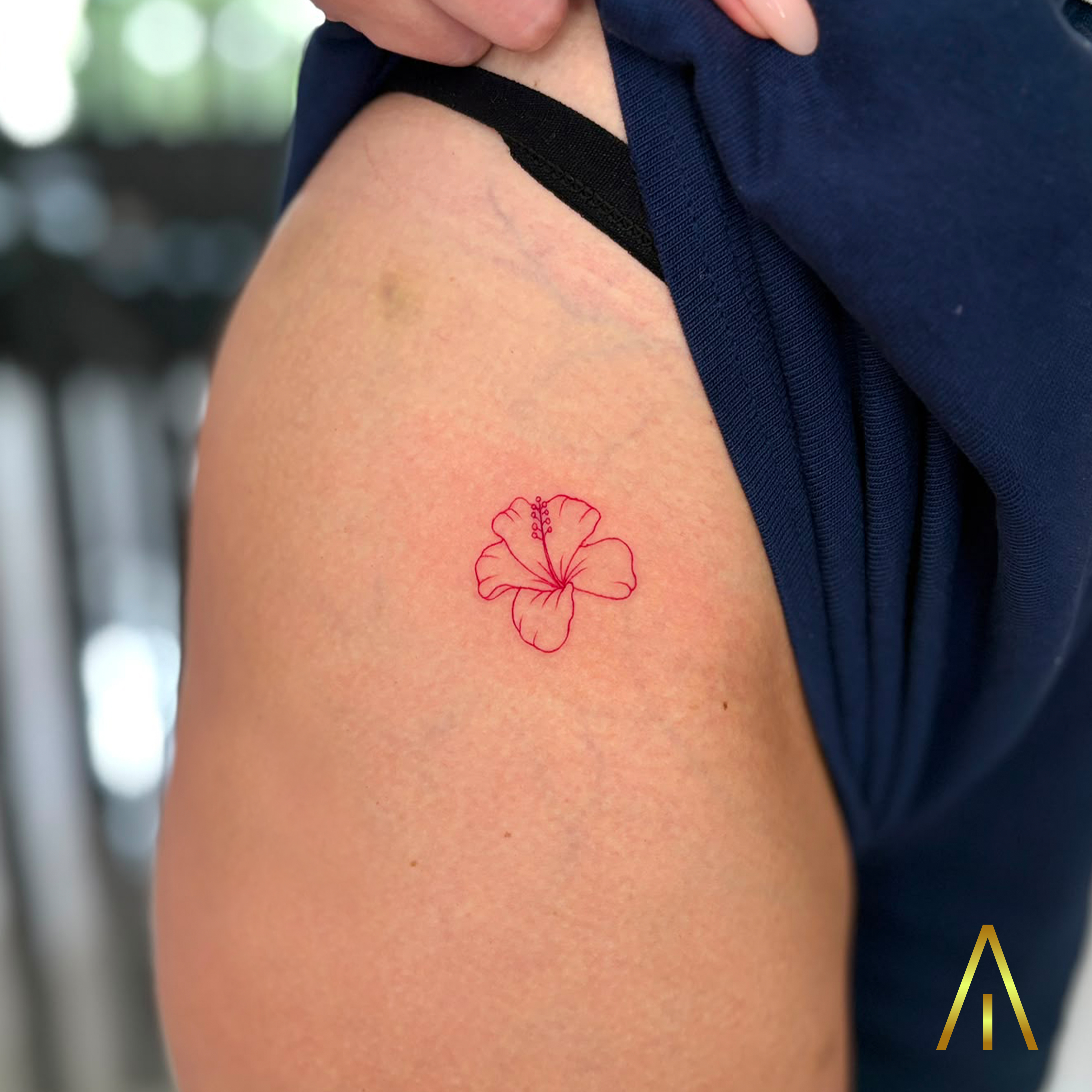 Miaa fine line red hibiscus flower thigh tattoo Chiang Mai
