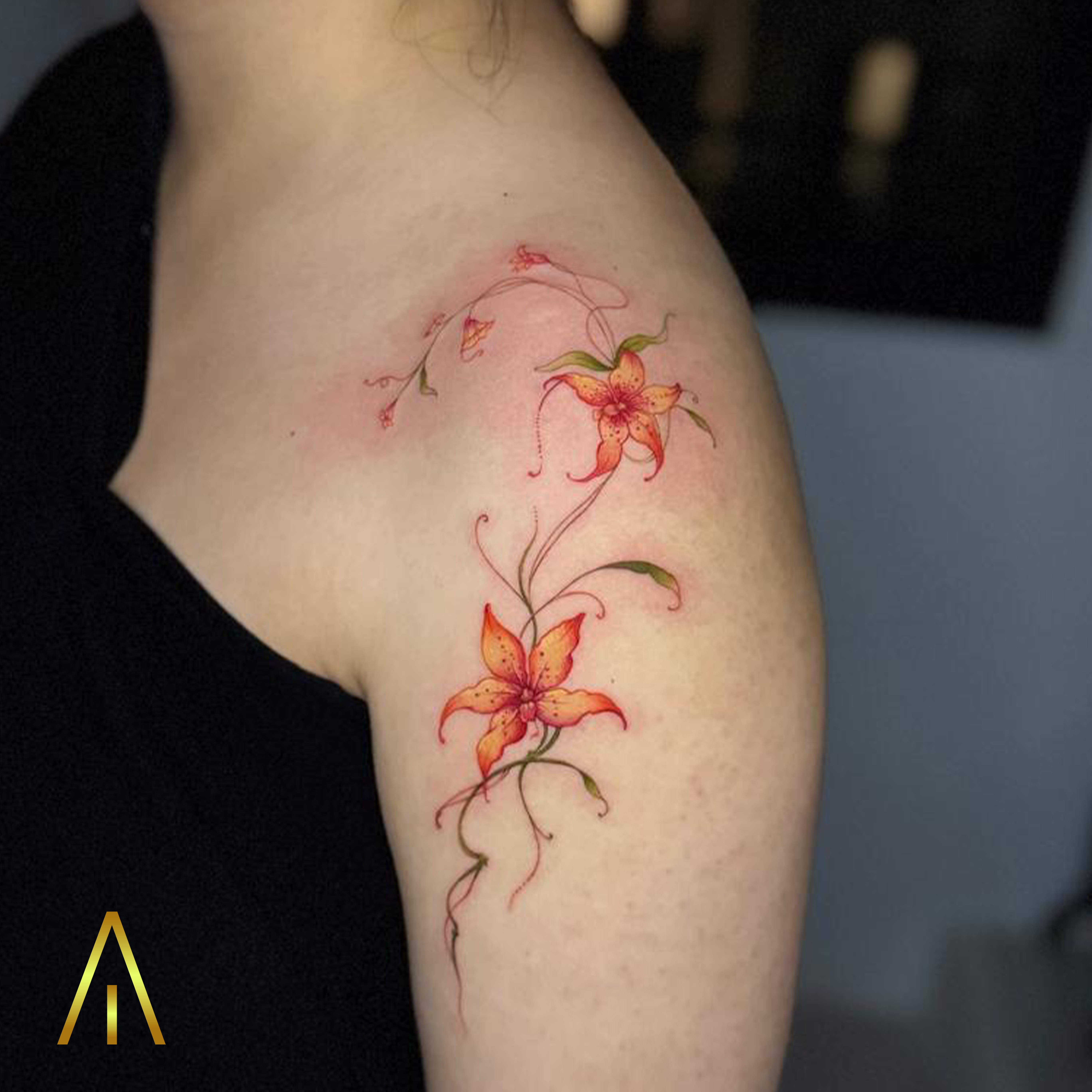 Orange and yellow lilies colour tattoo by Miaa Chiang Mai
