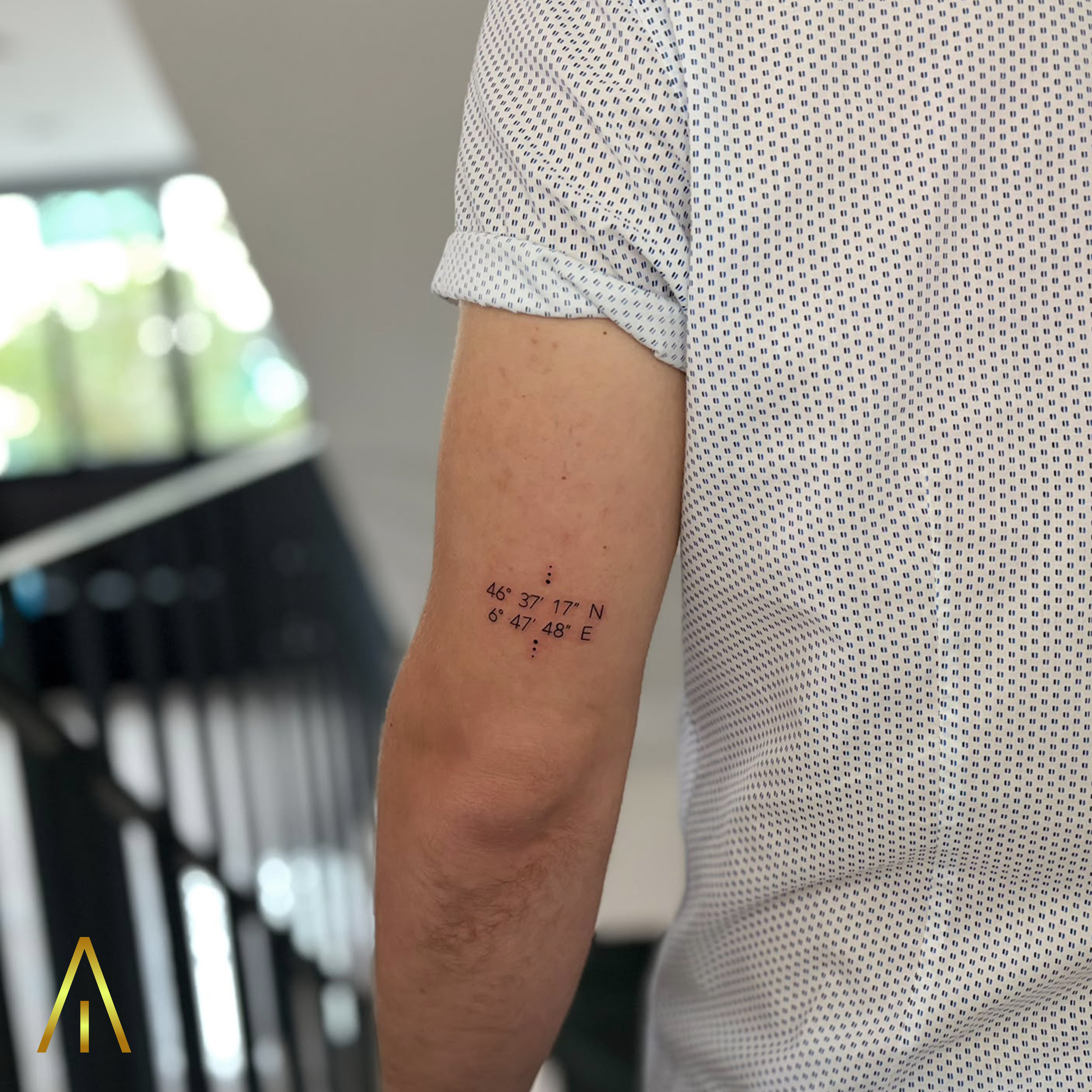 Miaa fine line coordinates upper arm tattoo Chiang Mai