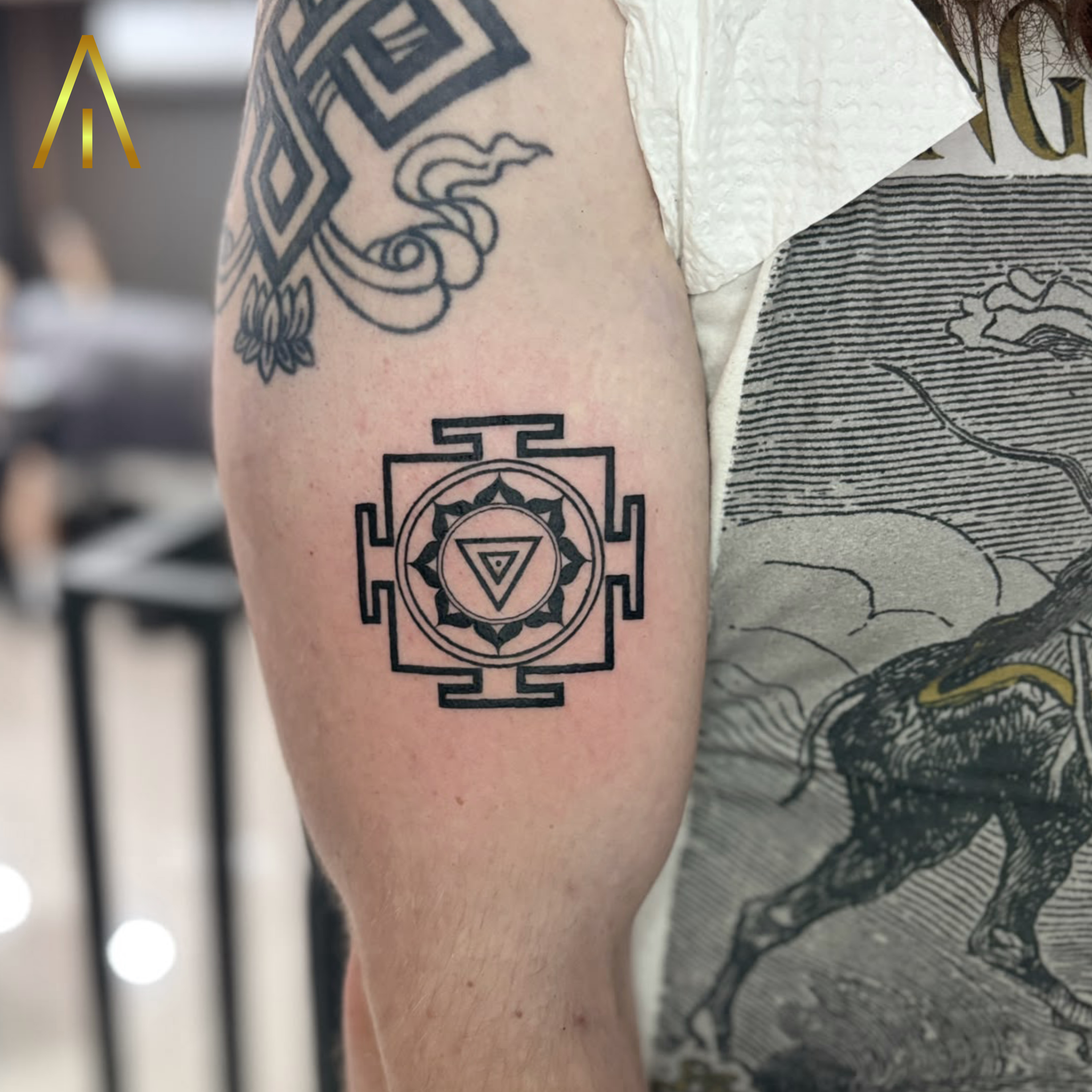 Mimi geometric lotus square frame upper arm tattoo Chiang Mai