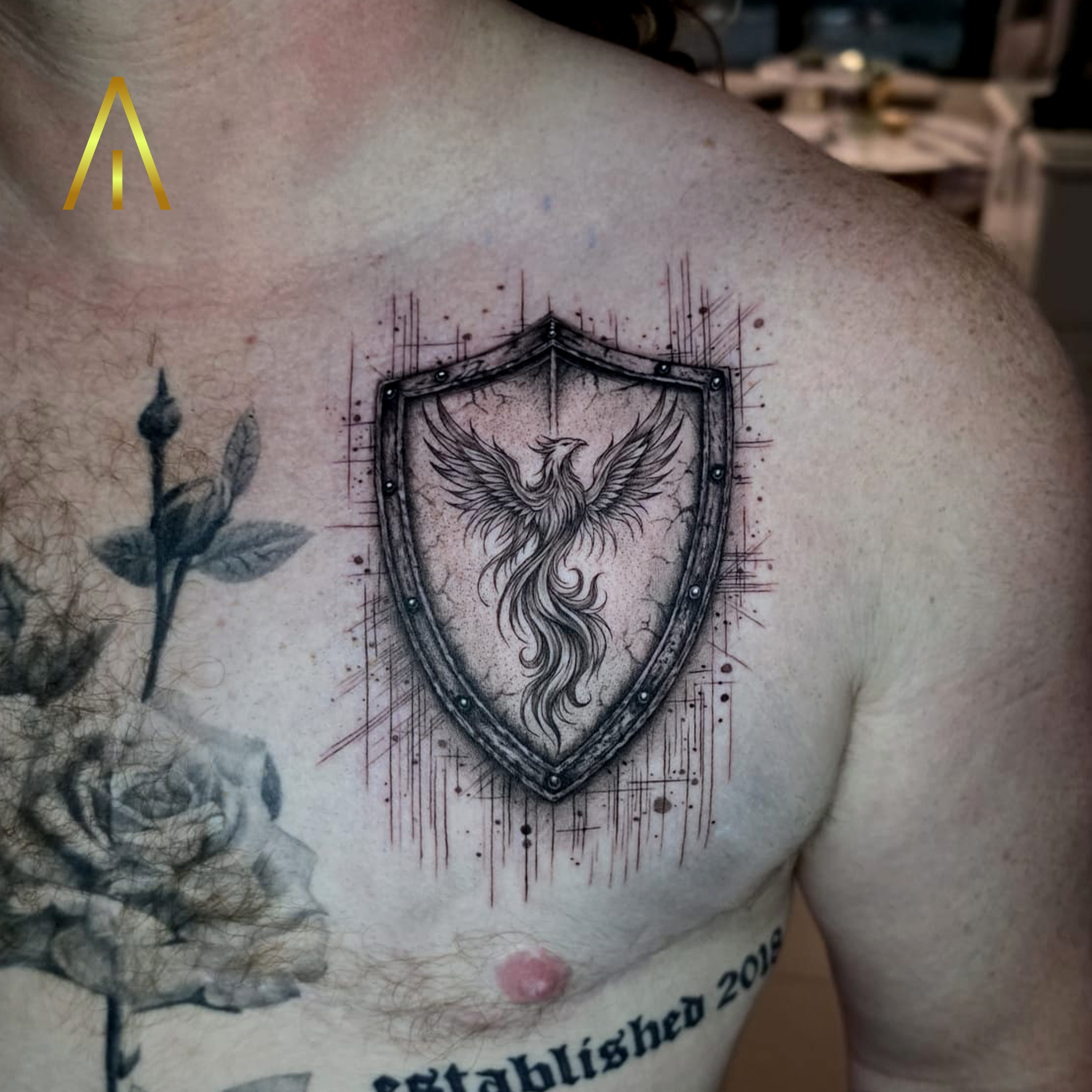 Phoenix shield black and grey tattoo by Miaa Chiang Mai