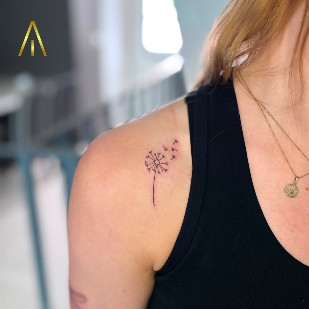 Fine line dandelion shoulder tattoo Chiang Mai