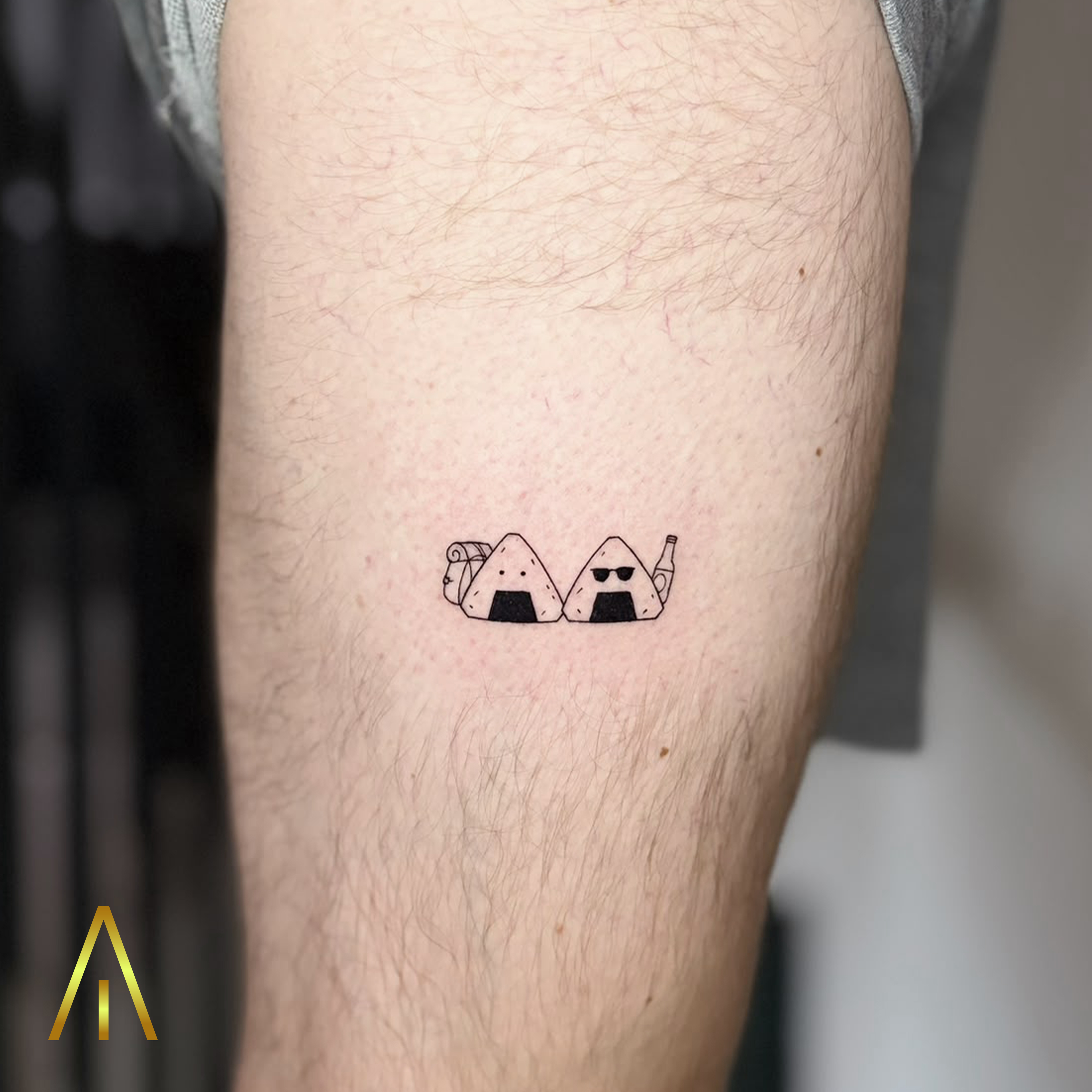 Mimi two onigiri rice ball characters upper arm tattoo Chiang Mai