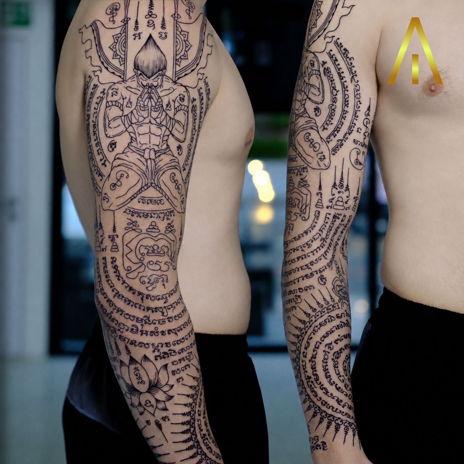 Sak Yant prayer figure sleeve tattoo Chiang Mai