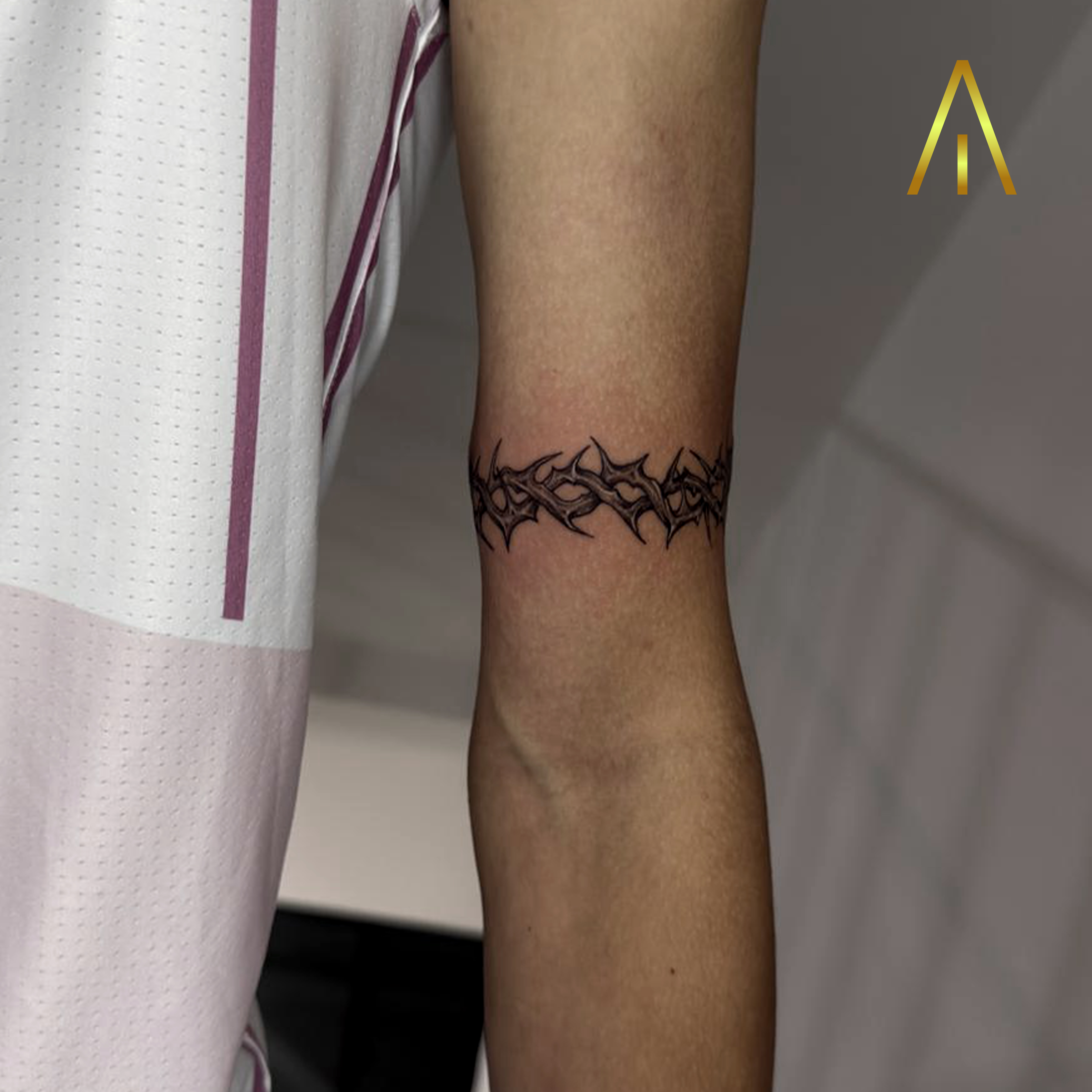 Minimal crown of thorns bicep band tattoo Chiang Mai