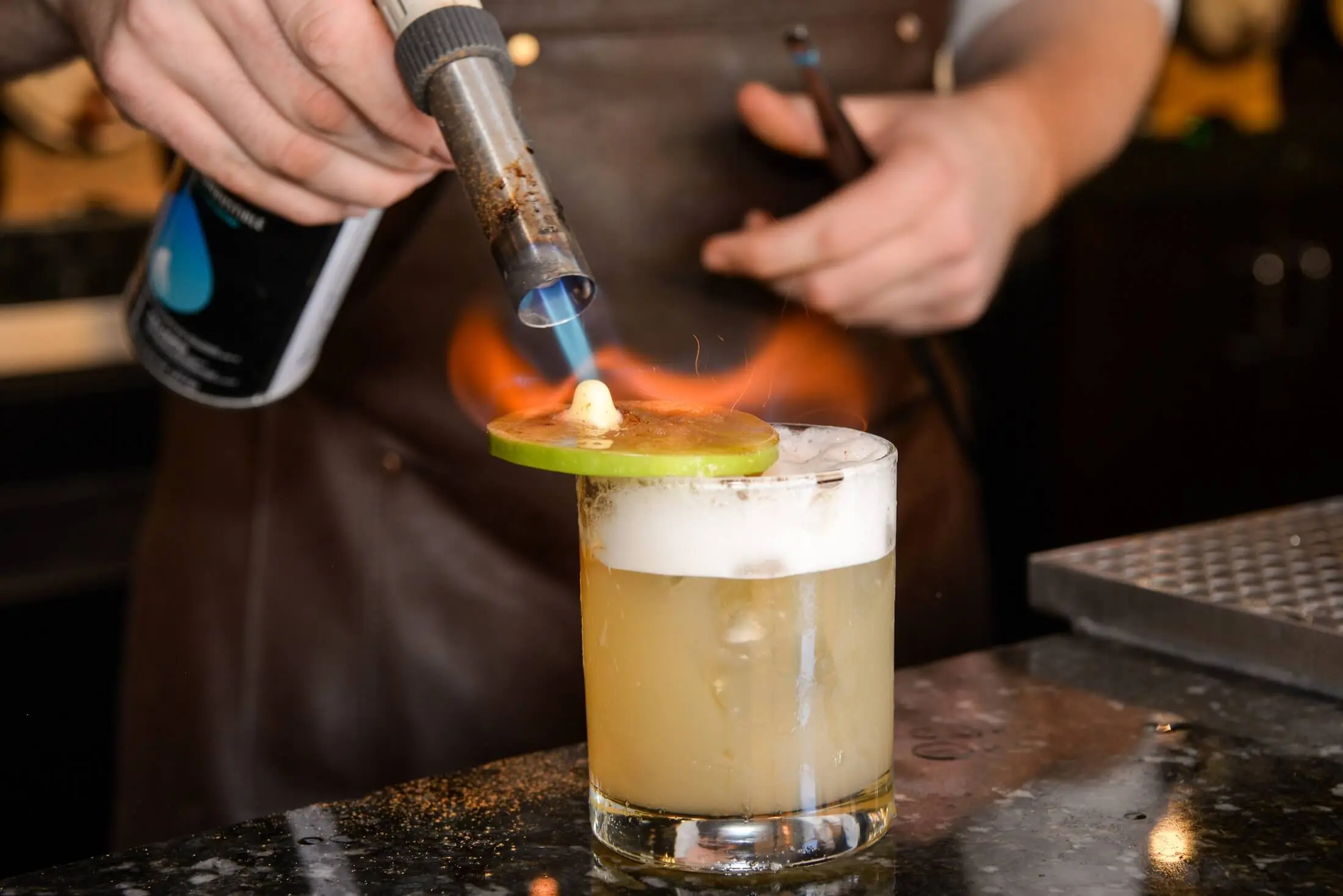 Apple Pie Harvest cocktail being torched