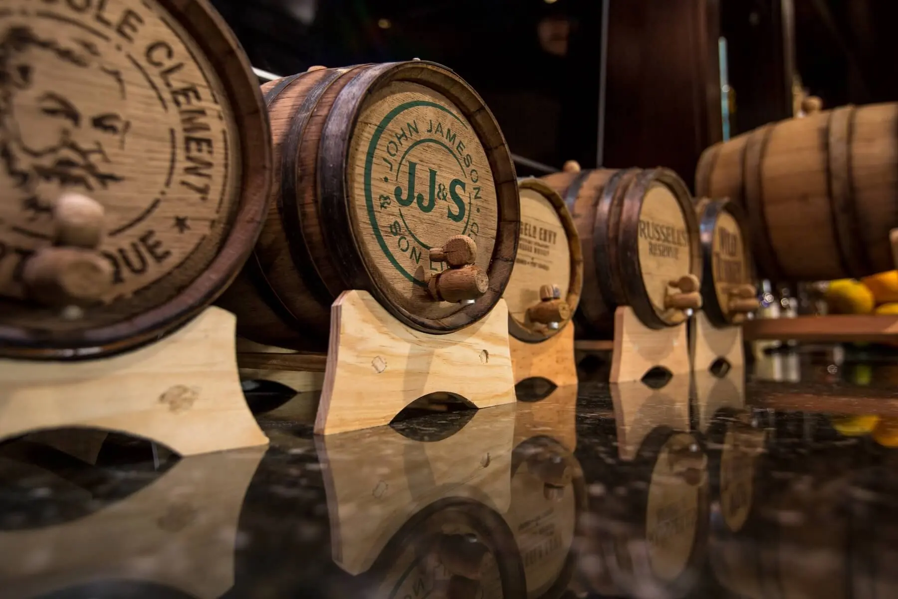 Barrel aged whiskies on bar