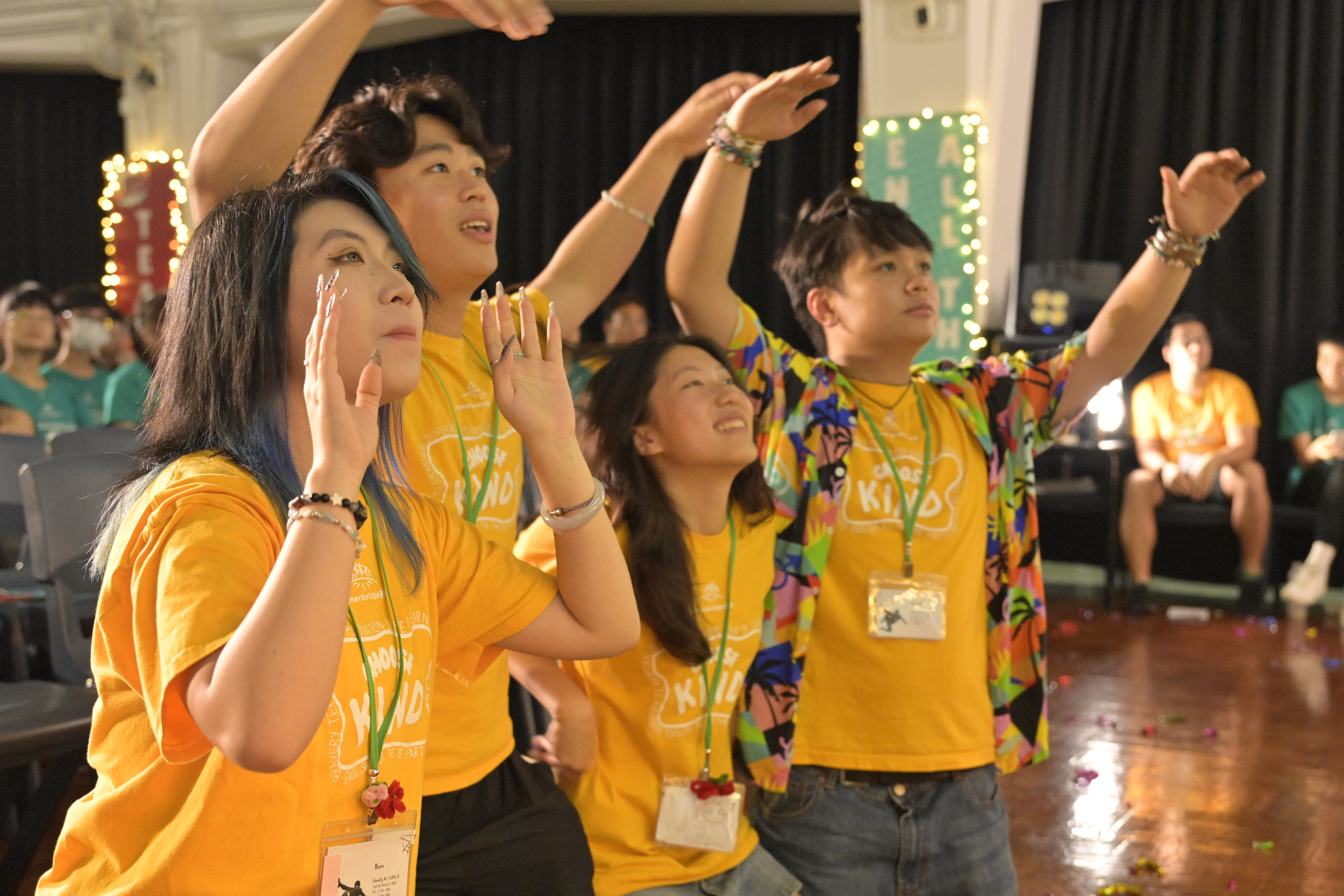 Summerbridge students in matching yellow t-shirts celebrating together
