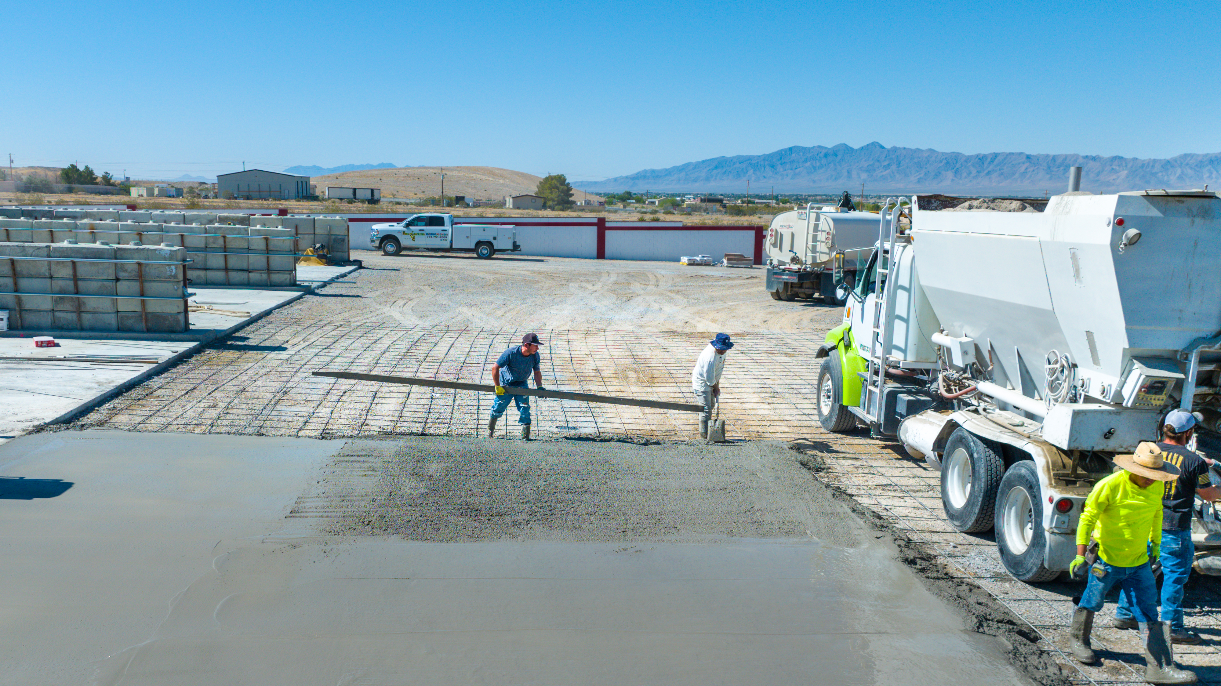 Workers leveling concrete