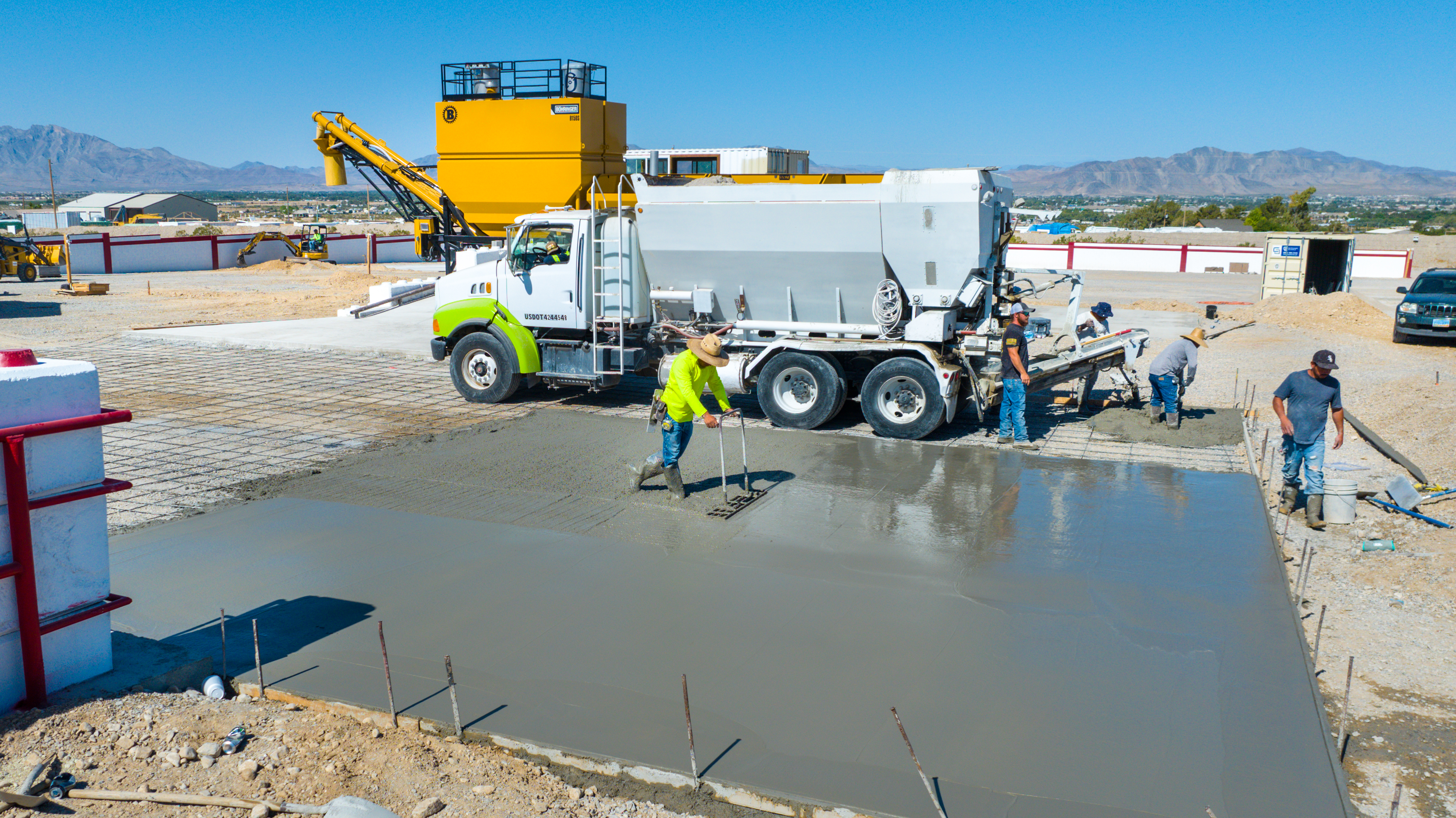 Crew pouring and leveling