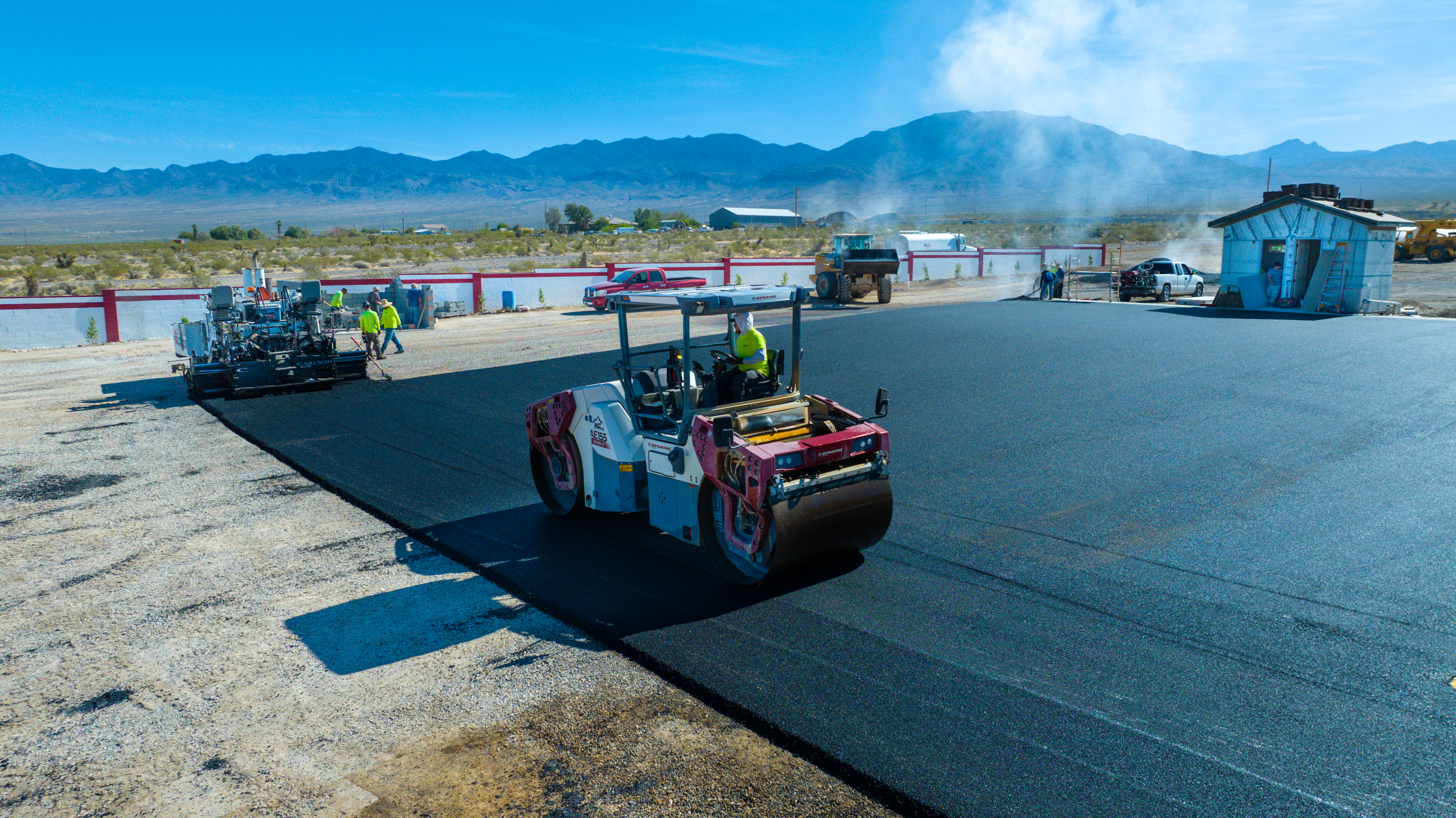 Roller and paving crew