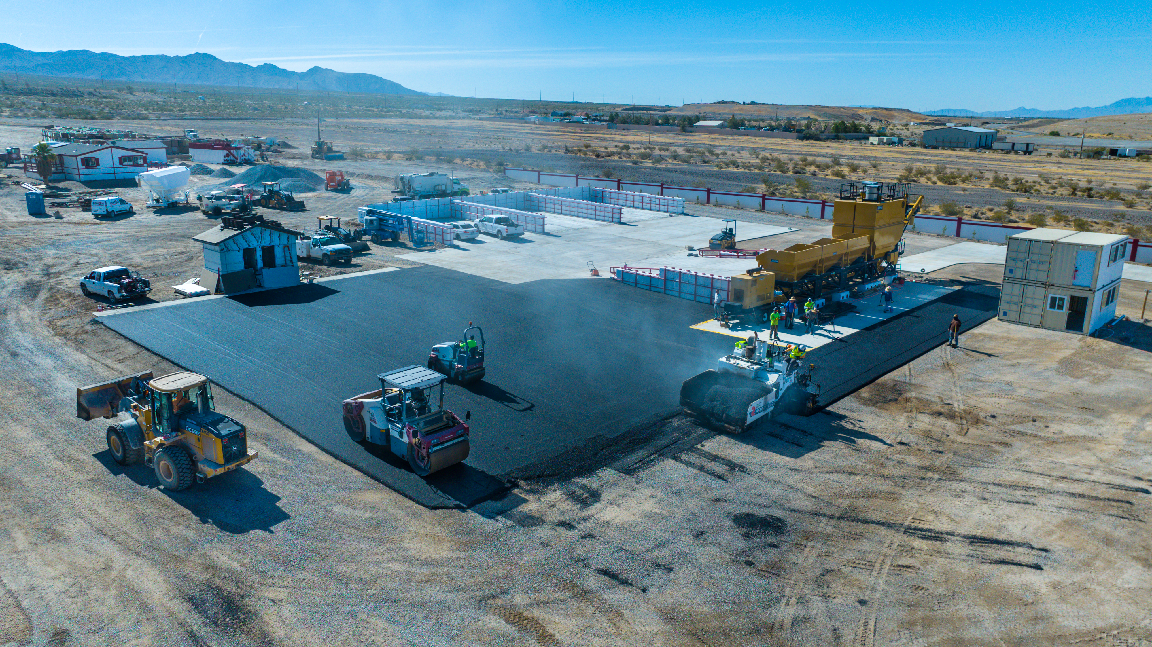 Fresh asphalt and roller