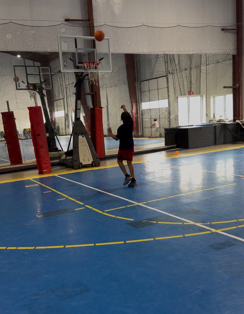 Athlete basketball shooting on court