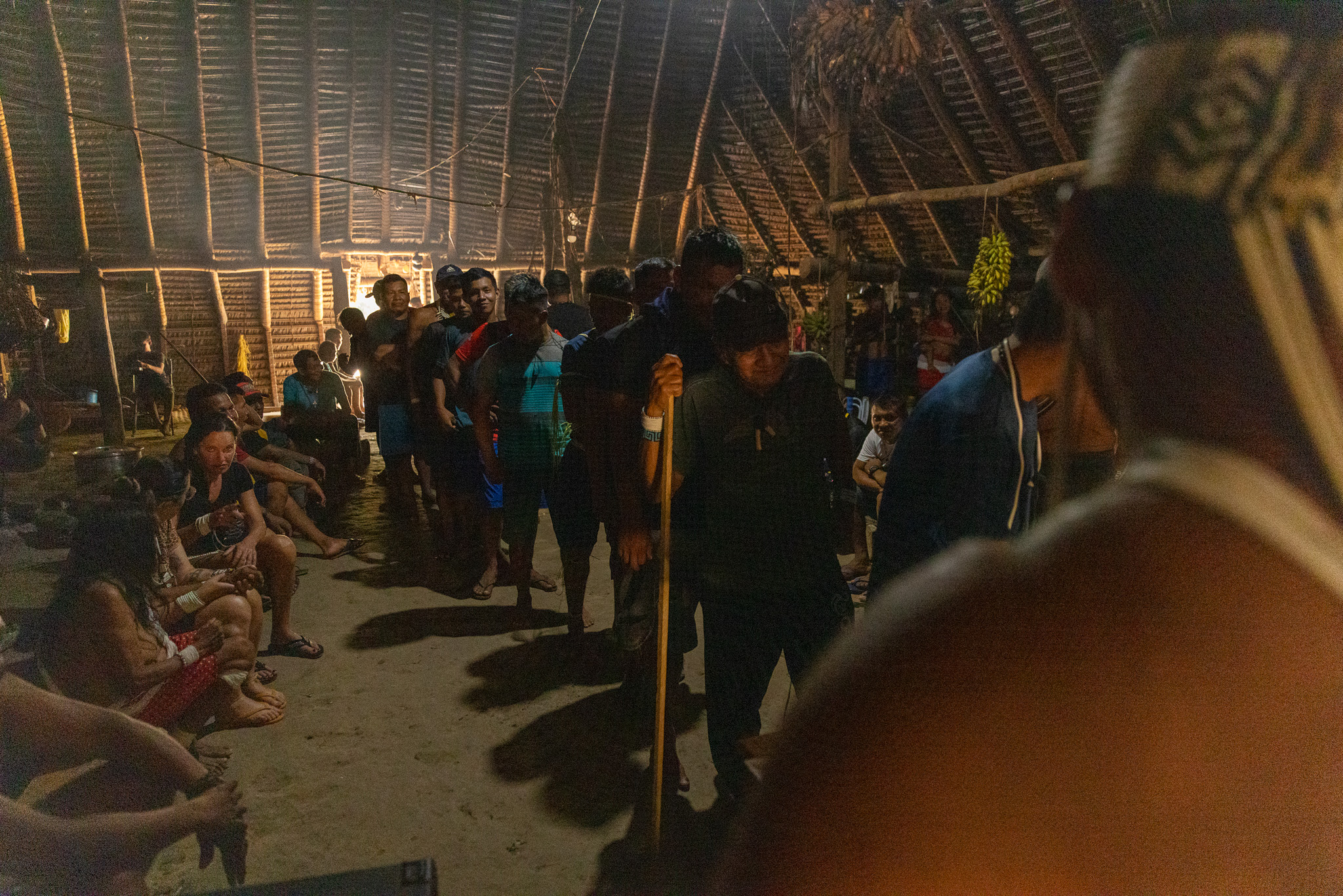 The full maloca is the true signal — the gathered community decides the path.