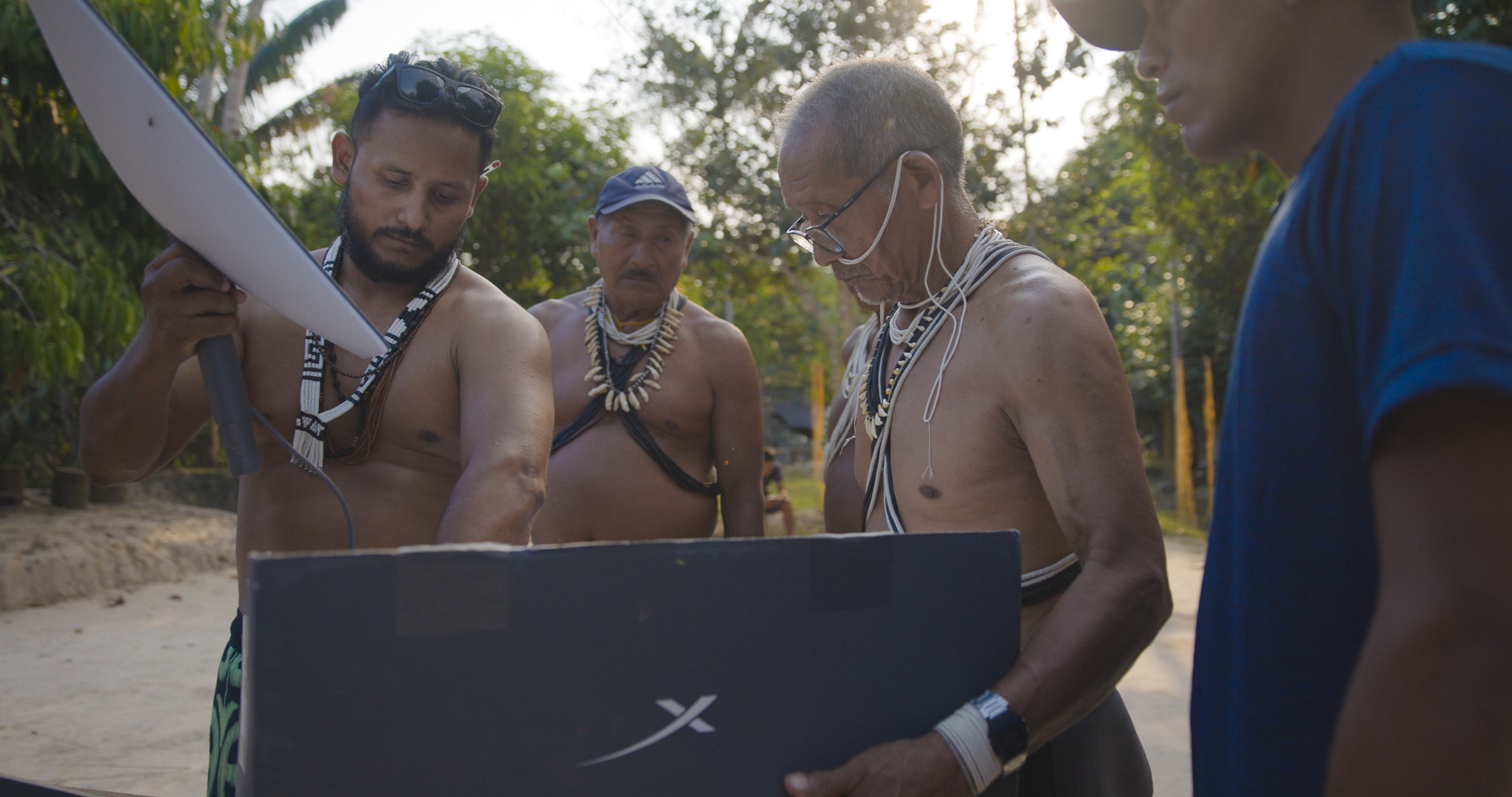 The antenna leaves the box among many hands.