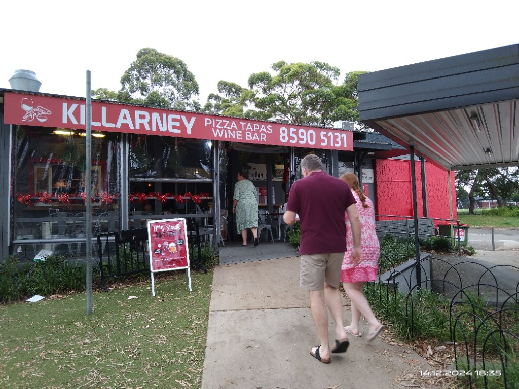 Killarney Pizza Tapas Wine Bar — rebranded, branded sign & customers walking in
