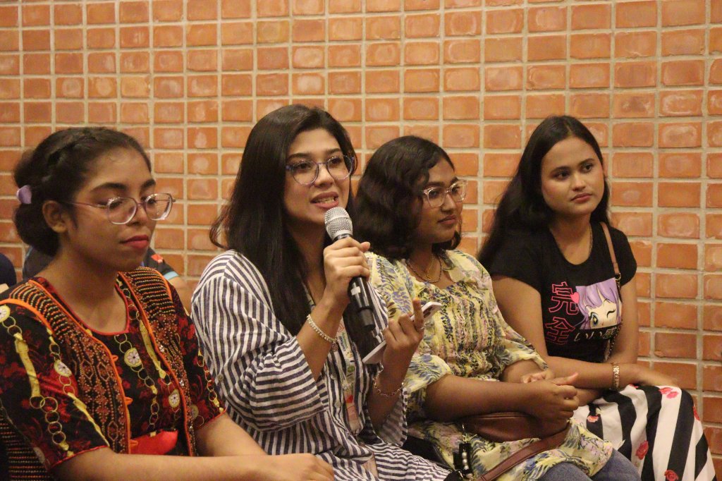 Audience members ask questions