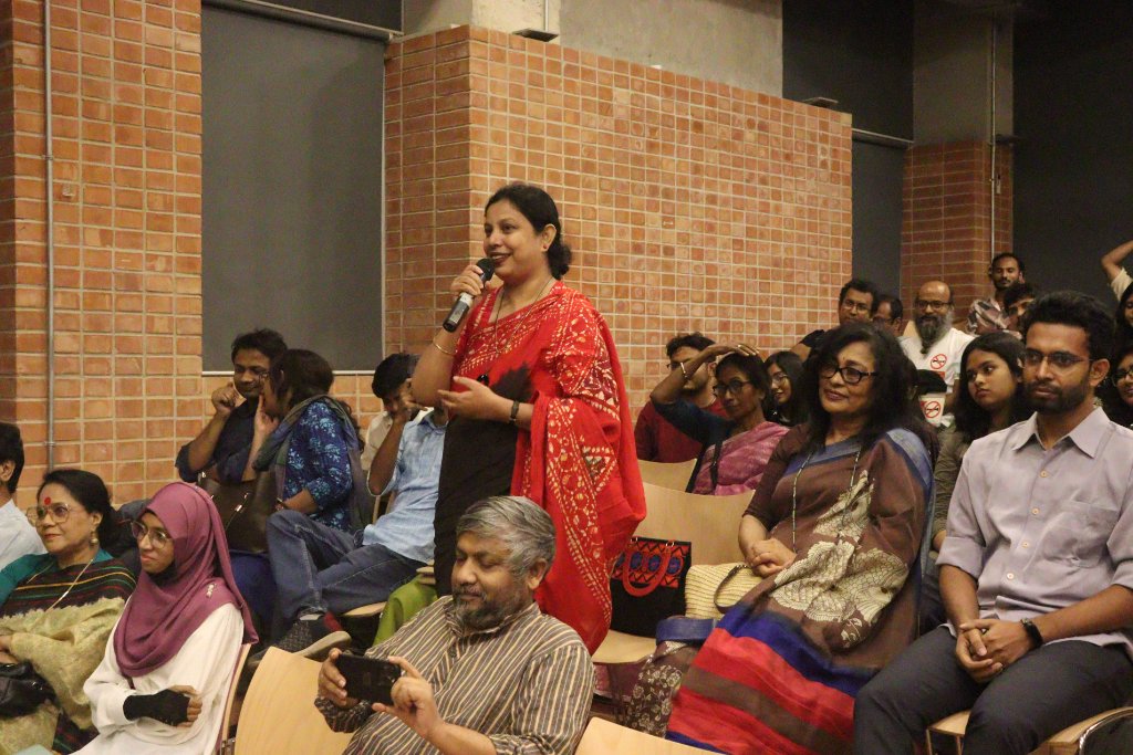 A guest addresses the audience