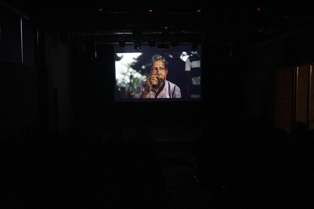 Film still on screen during a festival screening