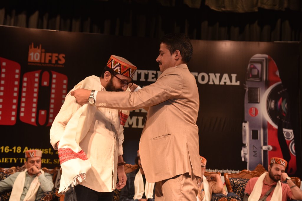 Traditional scarf presentation — IFFS Shimla