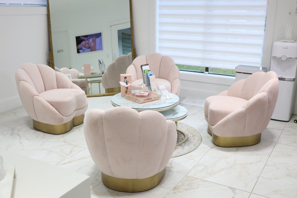 Le Spa Medical Spa waiting lounge with blush velvet chairs
