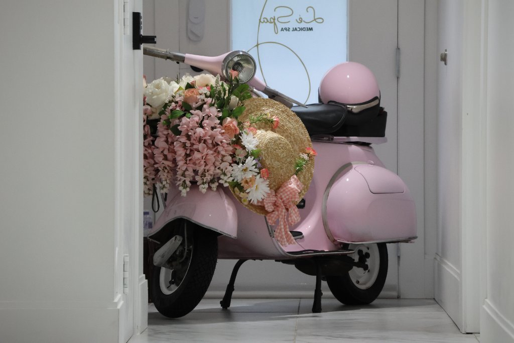 Le Spa Medical Spa signature pink Vespa decorated with flowers