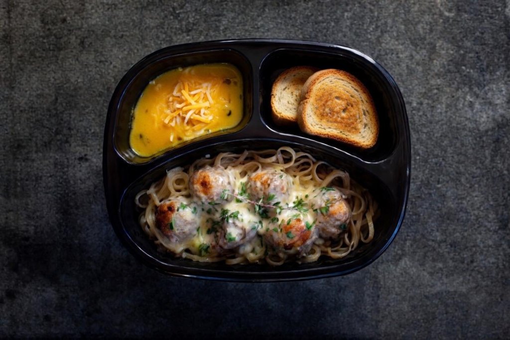 Wednesday Low Budget Meal Creamy Chicken meatballs in carbonara sauce served with spaghetti, garlic roll and gem squash filled with cheese and sweetcorn