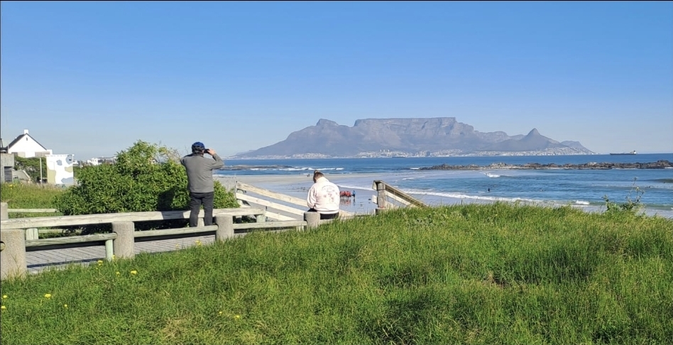 Boardwalk overlooking beach with Table Mountain