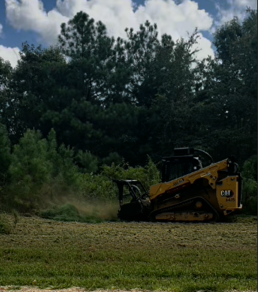 Back 40 CAT 275 skid steer with Fecon forestry mulching head grinding cedar, hardwood, and brush to organic mulch in a single pass — Middle Tennessee land clearing