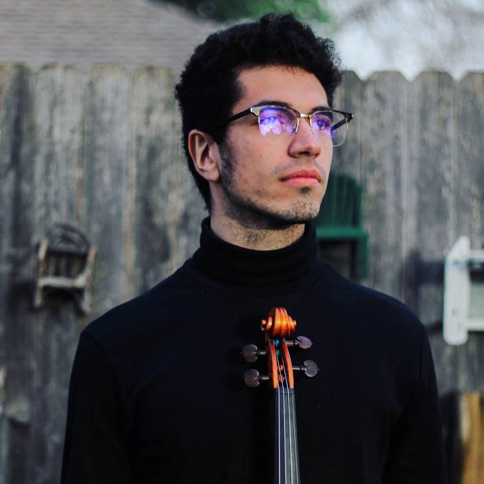 Henry Setton holding his violin