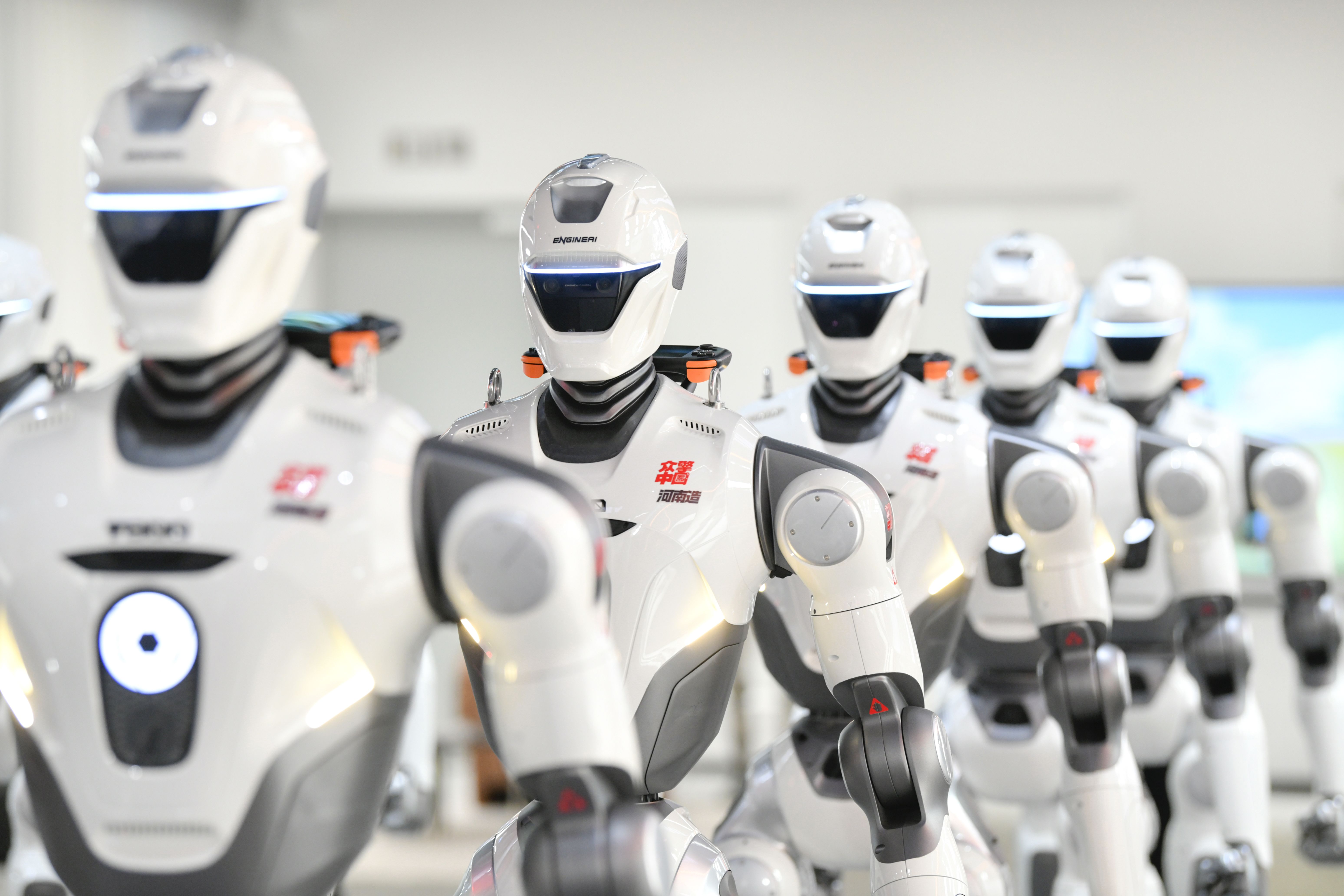 Chinese humanoid robots from several manufacturers displayed at a robotics conference.