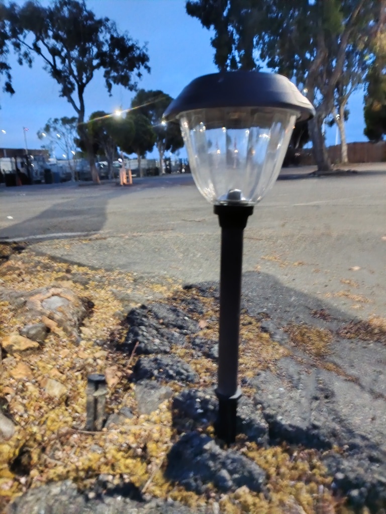 Sturdy Stake installed — light perfectly upright in rough ground