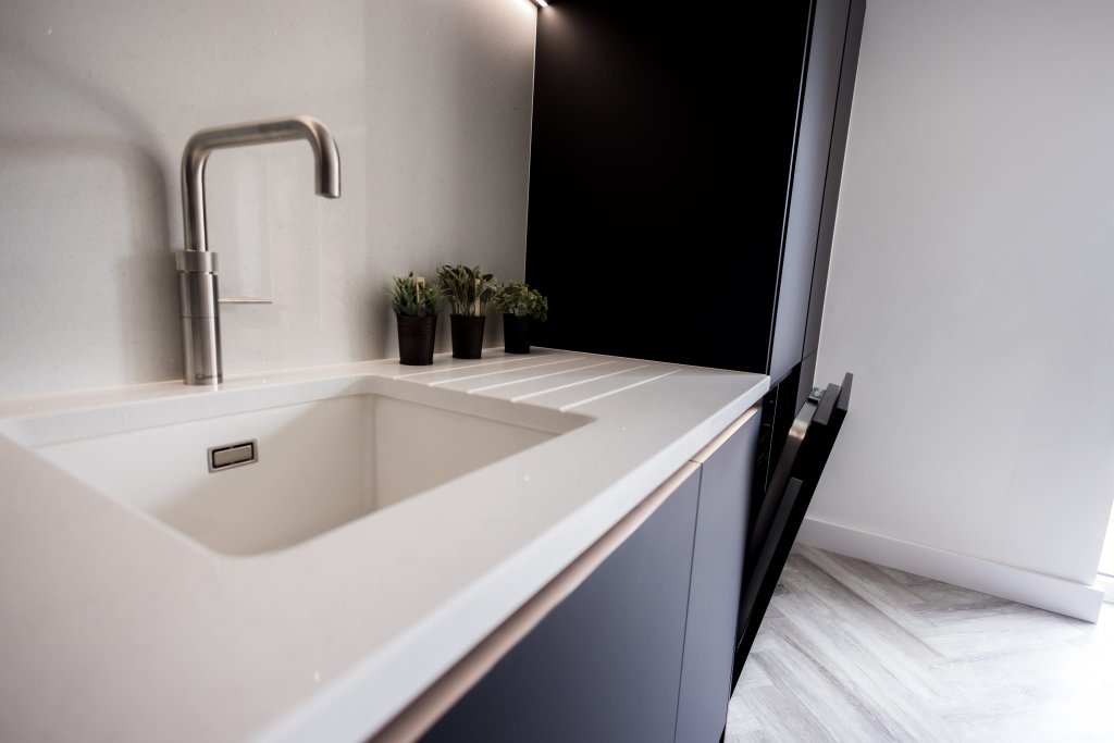Quartz worktop and undermount sink detail — CJ Marra workshop, Wiltshire