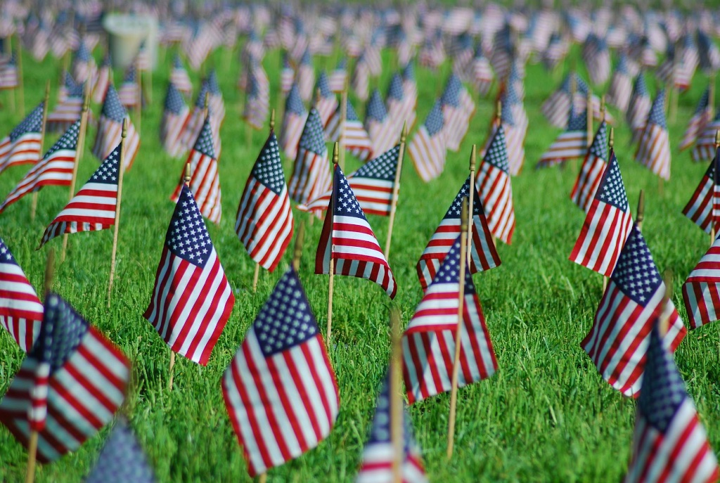 Fields of American flags honoring fallen soldiers
