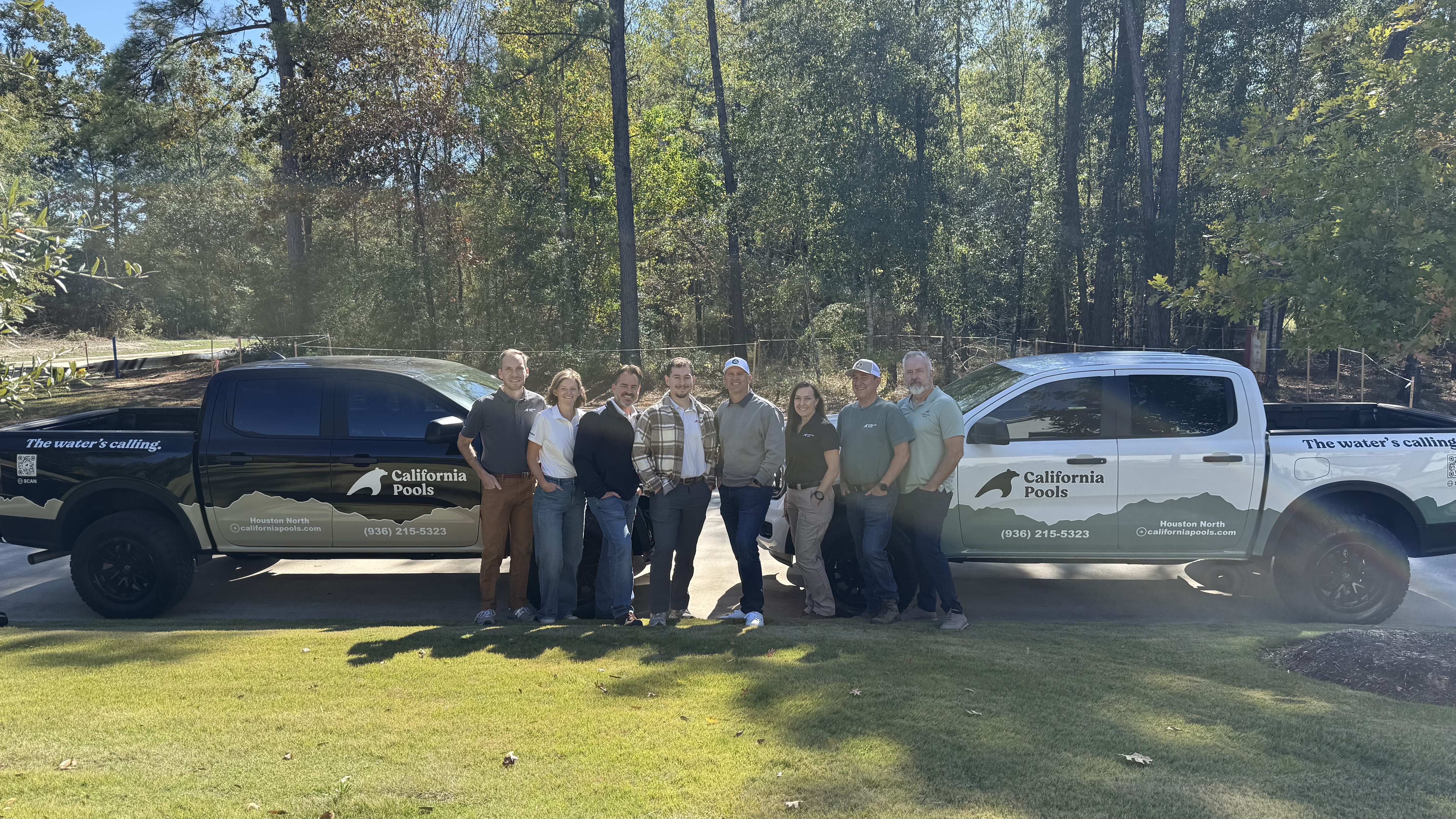California Pools franchise team and branded trucks