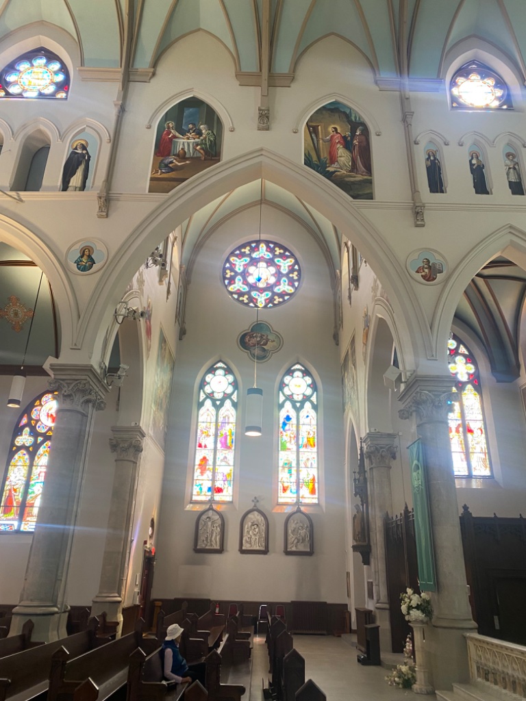 Nave upper walls with paintings and stained glass