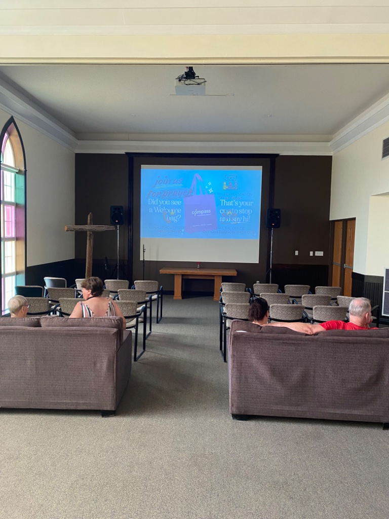 Compass Community Church sanctuary with projector screen