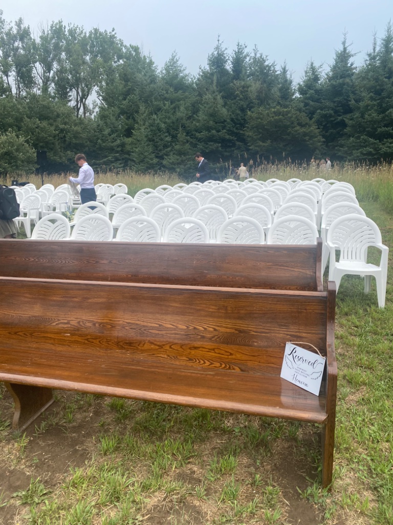 Pew sign reserved in memory of those watching from heaven