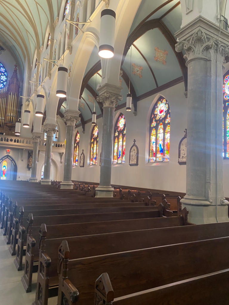 Side aisle view toward the columns and altar