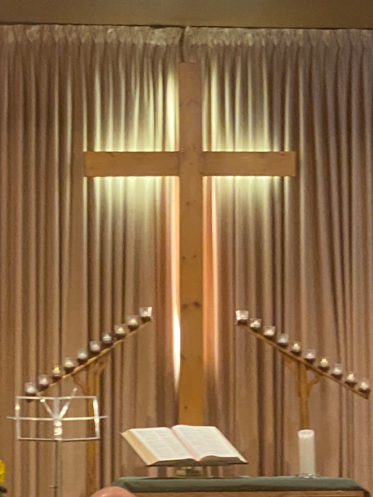 Altar cross with glowing light
