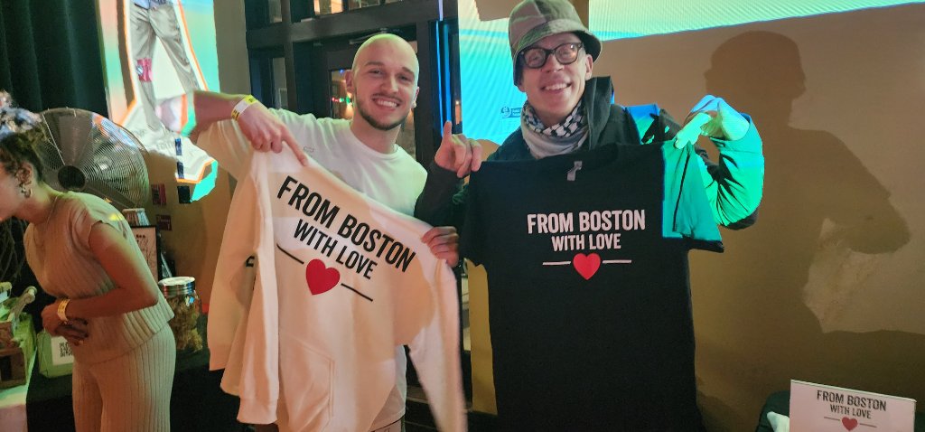 FBWL members holding up From Boston With Love shirts