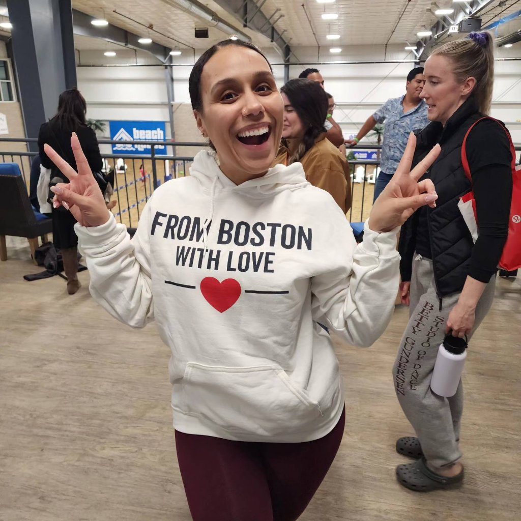 FBWL member wearing From Boston With Love hoodie after race