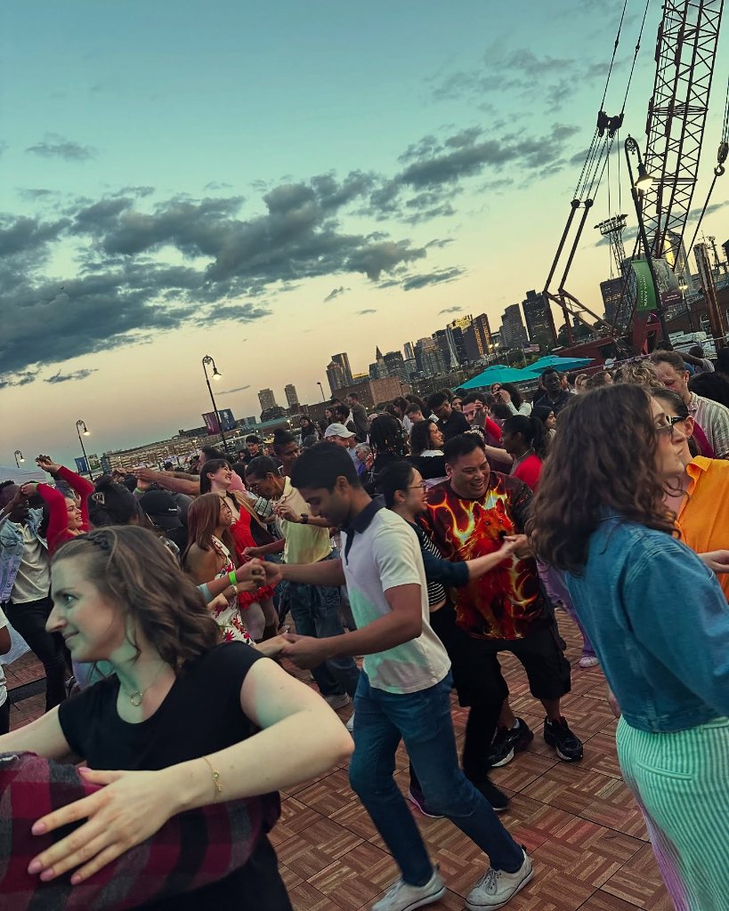 Social dancing at the Boston waterfront at sunset