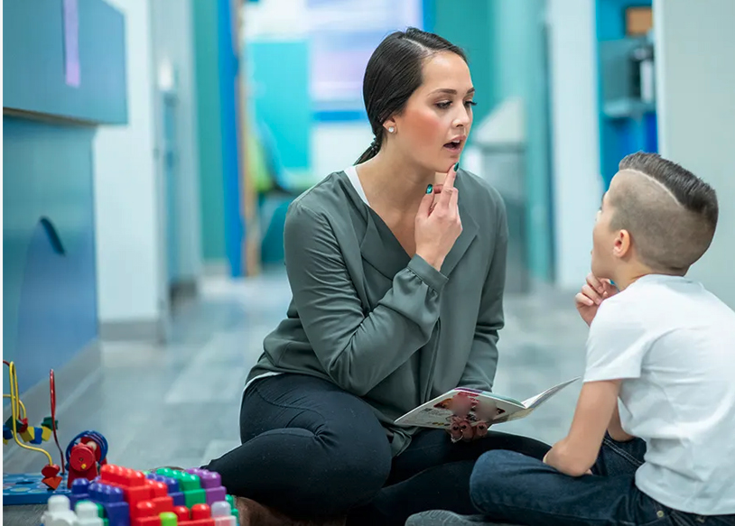 Therapist working with child