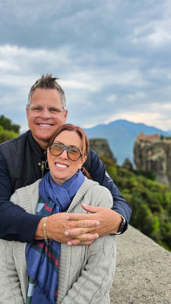 Couple at Meteora with monastery views