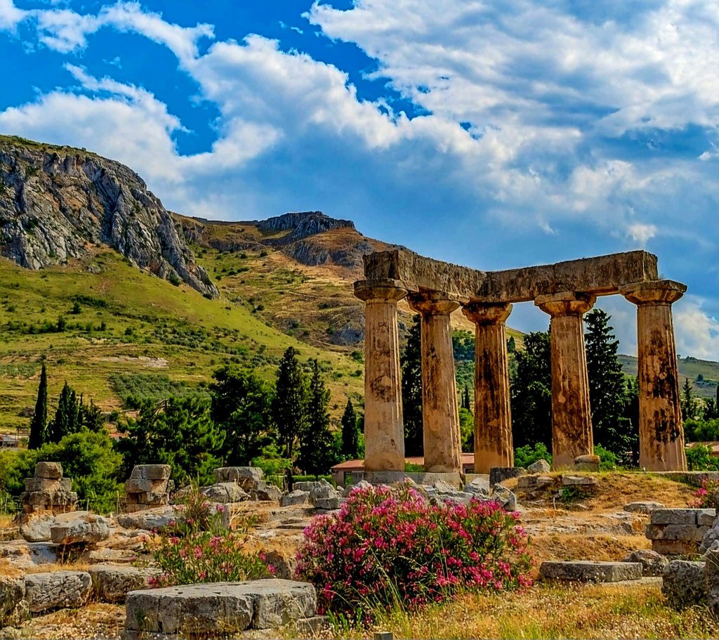 Ancient Corinth columns with flowers