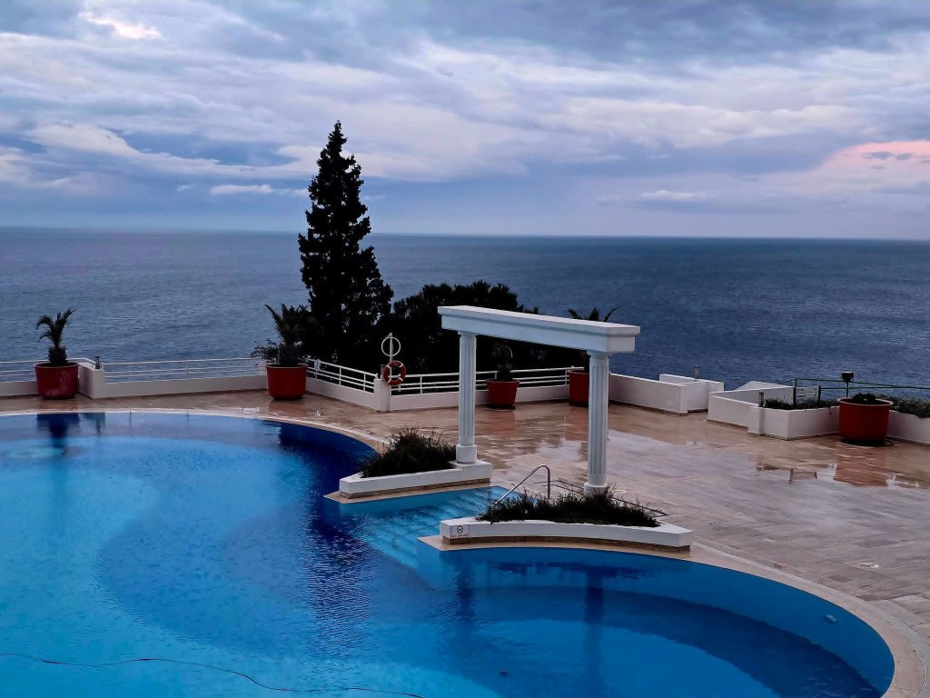 Hotel pool overlooking the Aegean Sea — Kuşadası