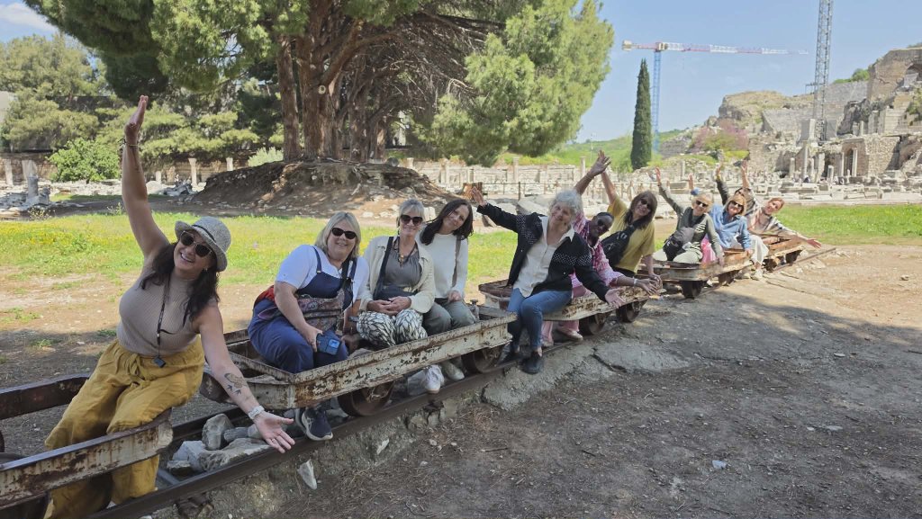 Ladies sitting on rails — Ephesus excavation site