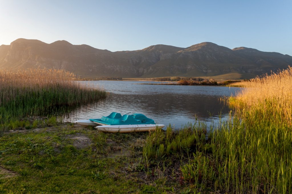 Paddle boat on the river at sunset