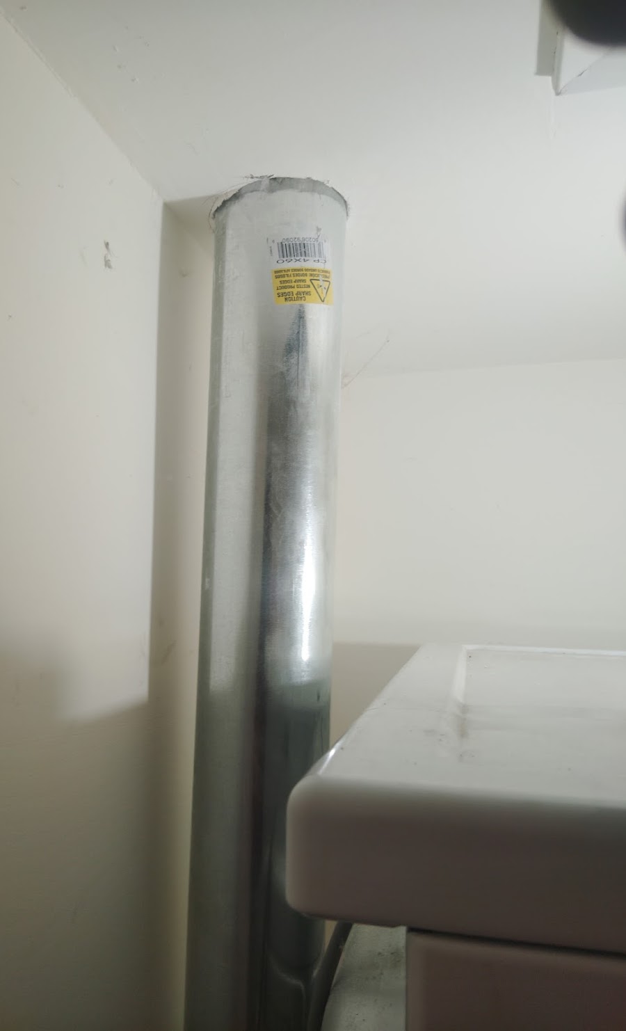 New dryer vent pipe installation — metal rigid duct replacement